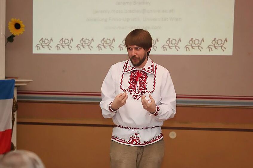 Lecturer in traditional costume.