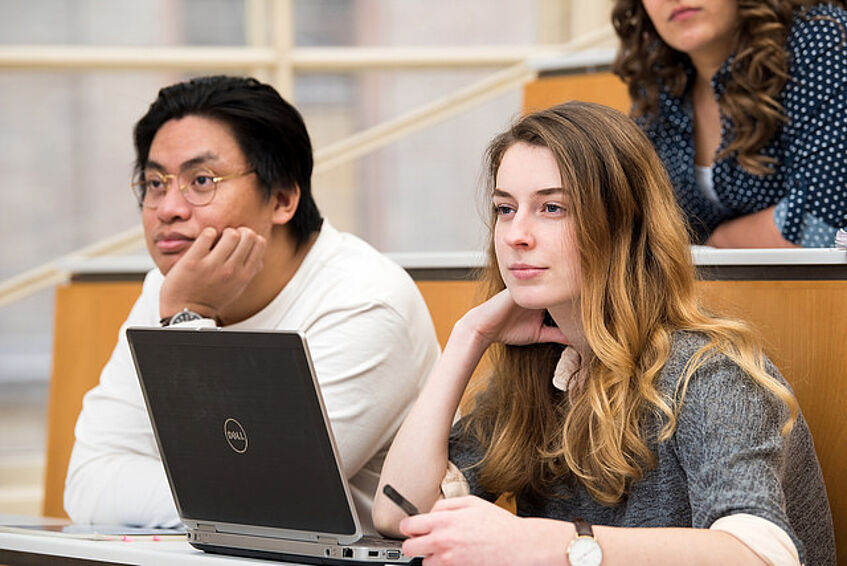 Two students in the lecture hall.