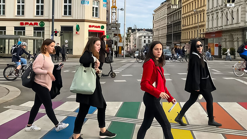 Students walking on a colorfull crosswalk