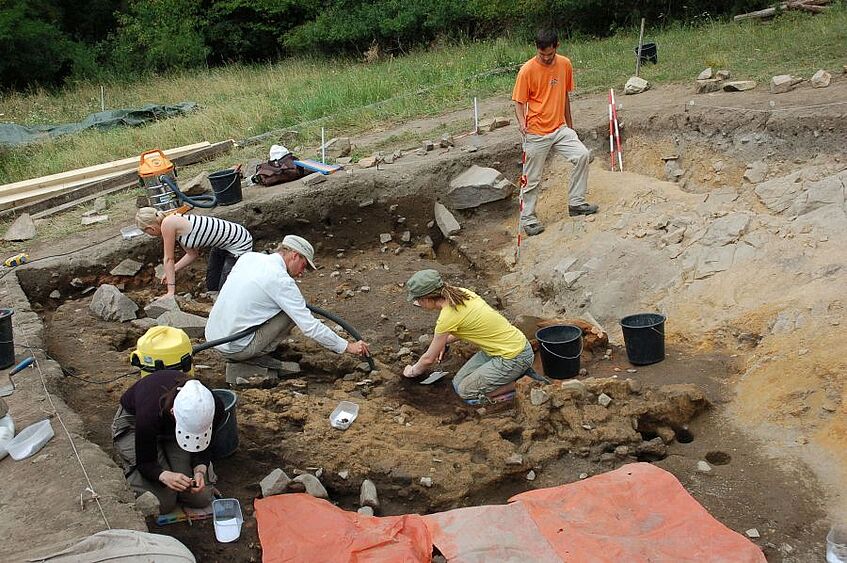 Archaeologists at work at an archeological  excavation site.