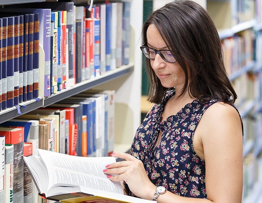 Student browsing for books in the library.