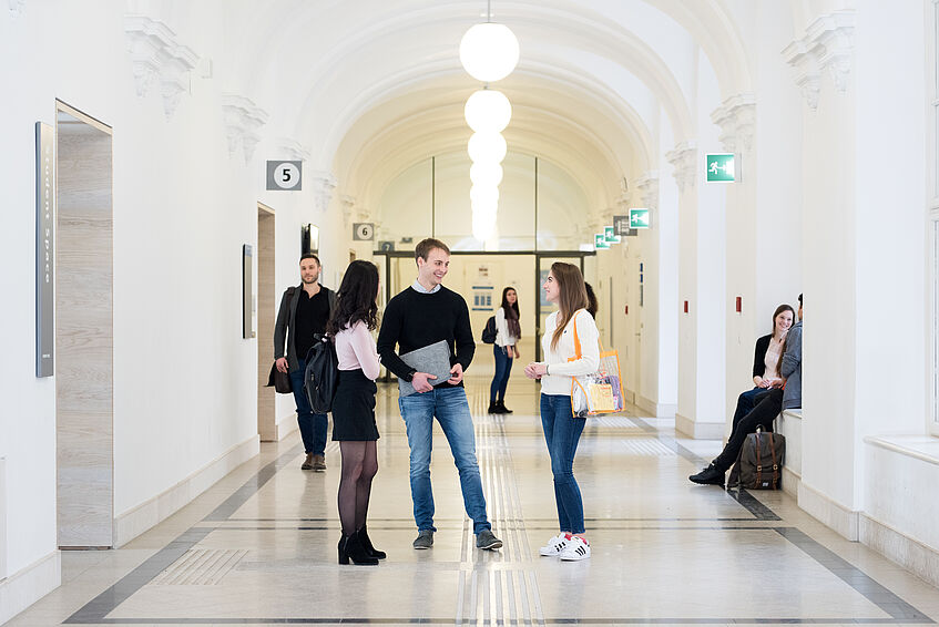 Students sitting in the main building of University of Vienna