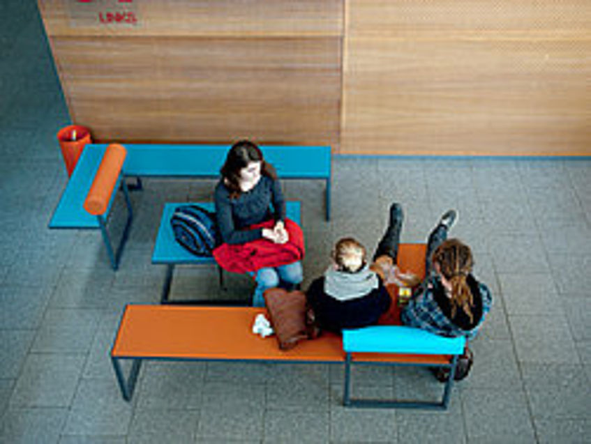 Students sitting in the lecture hall center.